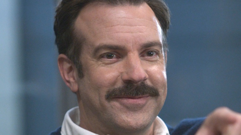 Jason Sudeikis smiling on "Ted Lasso" 