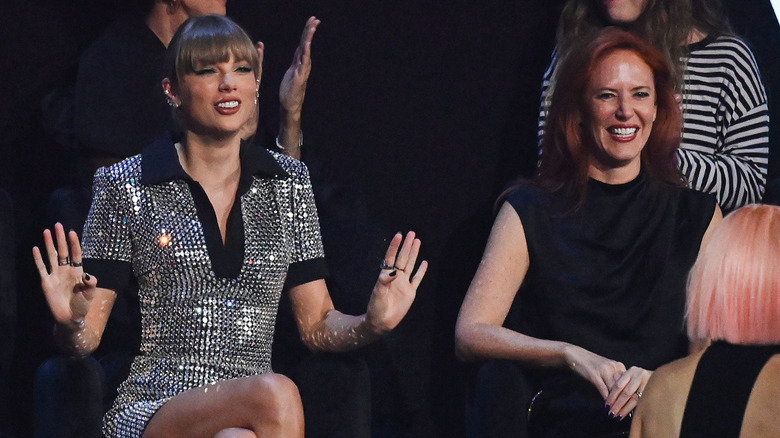 Taylor Swift and Tree Paine smiling
