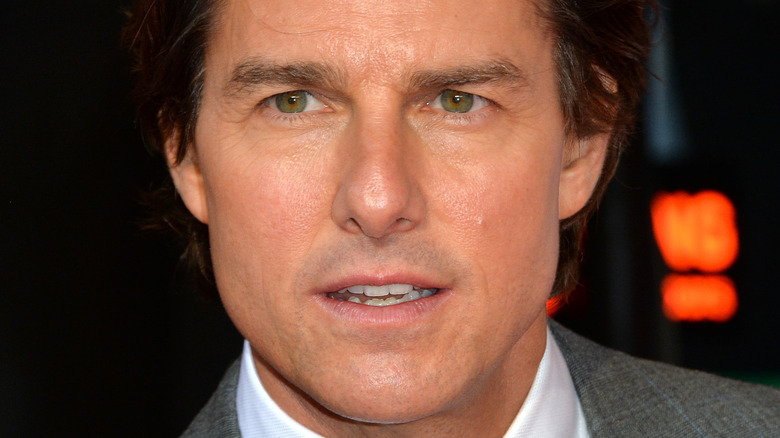 Tom Cruise with a serious expression