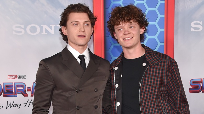 Tom holland and Harry holland smiling and posing