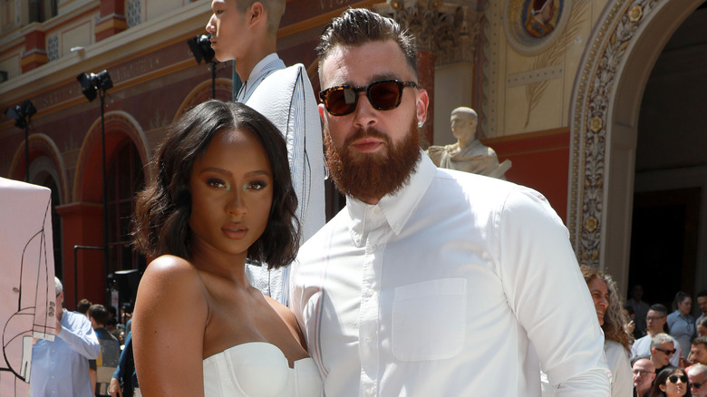 Travis Kelce and Kayla Nicole posing
