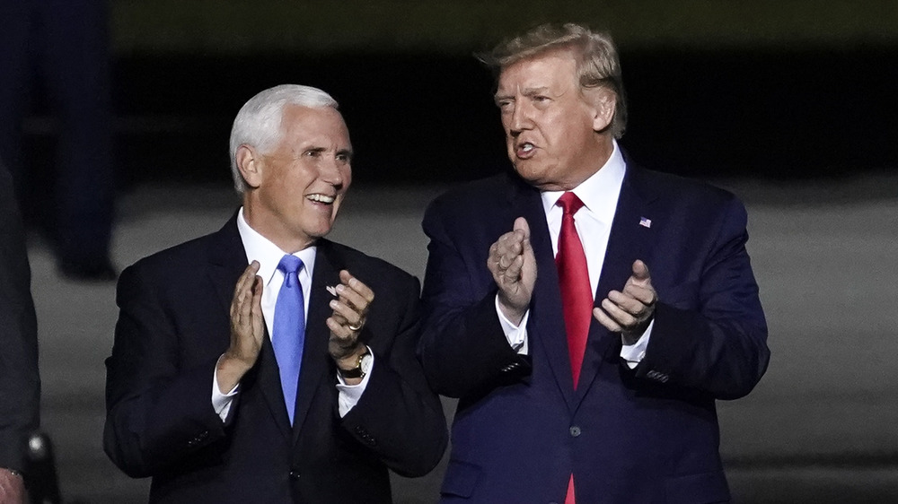 Donald Trump and Mike Pence clapping