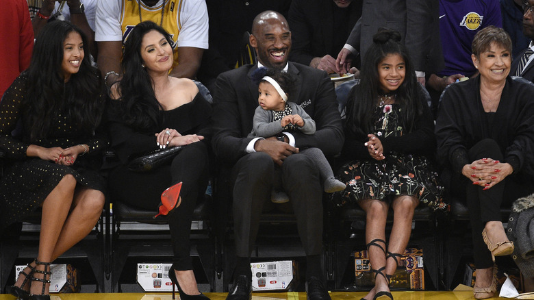 Natalia, Vanessa, Kobe, Bianka, and Gianna Bryant sitting with Sofia Laine