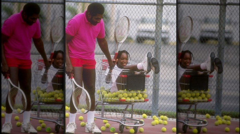 Richard Williams pushing Venus Williams in a shopping cart