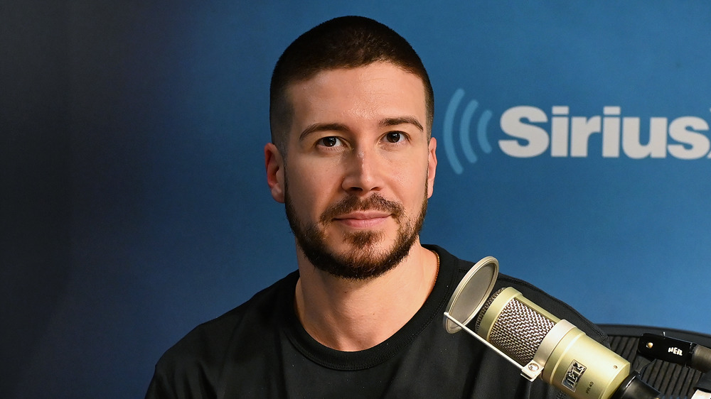 Vinny Guadagnino posing with mic