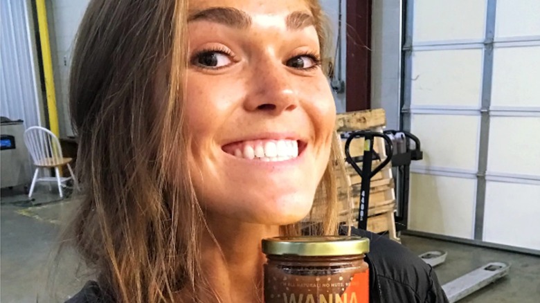 Melissa Bartow smiling holding jar Wanna Date 