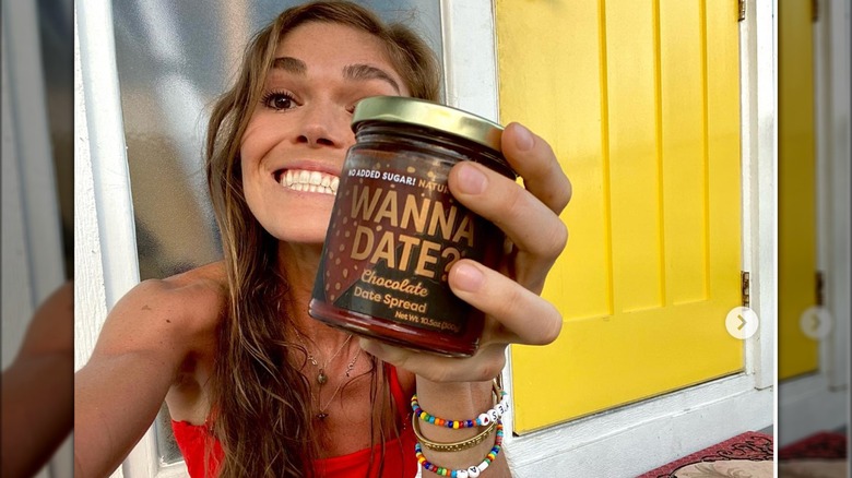 Melissa Bartow holding jar Wanna Date?
