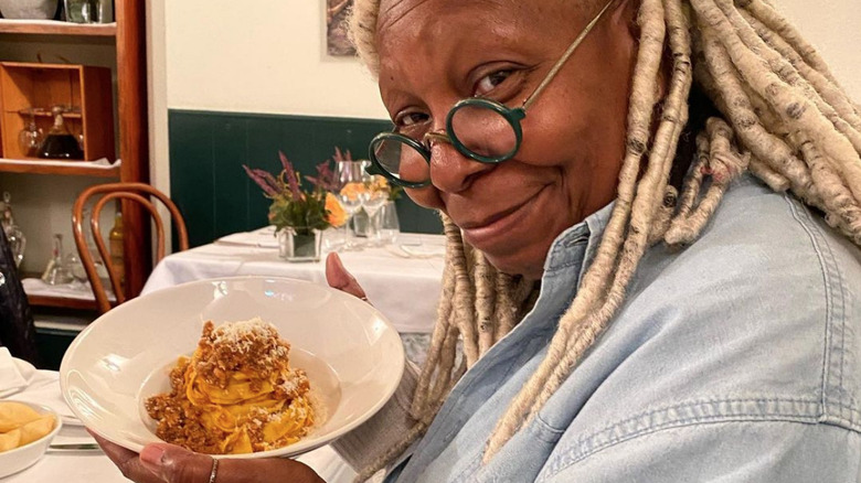 Whoopi Goldberg eating pasta 