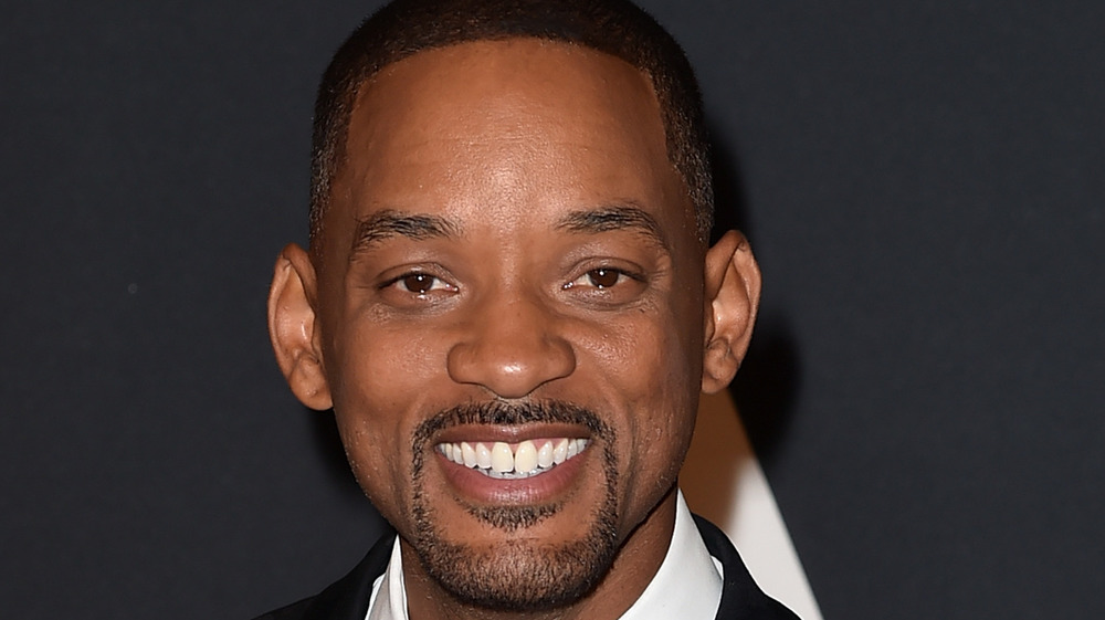 Will Smith smiling on red carpet