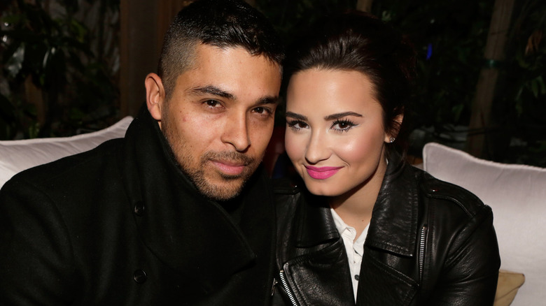 Wilmer Valderrama, Demi Lovato seated