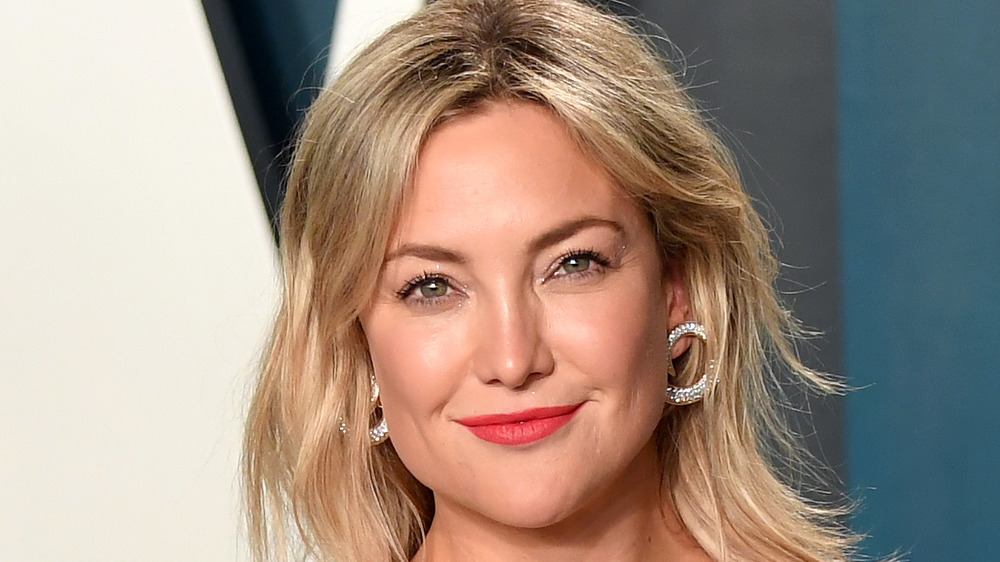 Kate Hudson smiling at a red carpet event