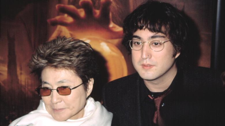 Yoko Ono smiling next to Sean Lennon 