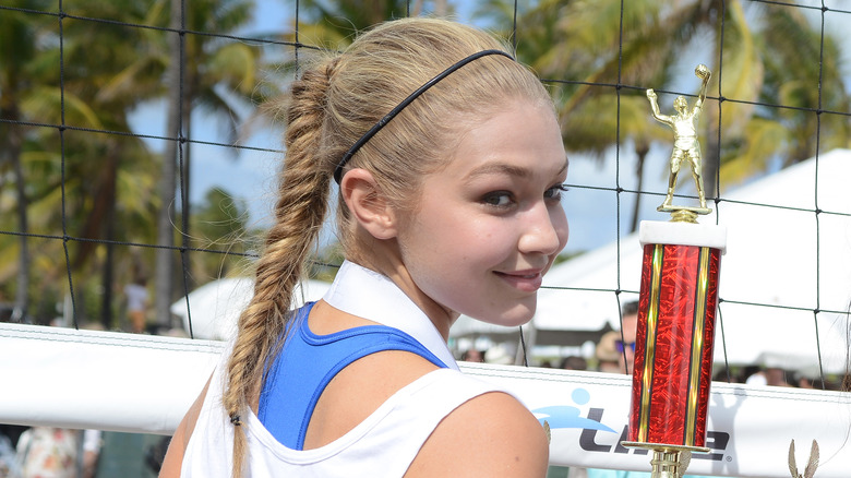 Gigi Hadid with a volleyball trophy