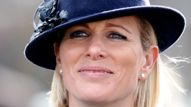 Zara Tindall gives a small smile at a public engagement