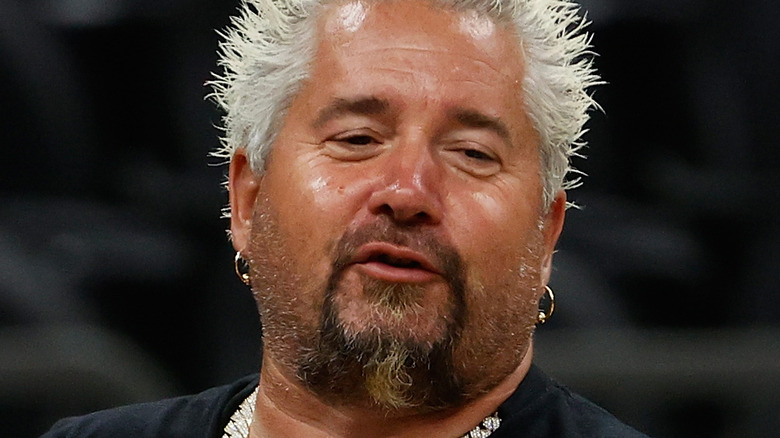 Guy Fieri speaking and looking to the side