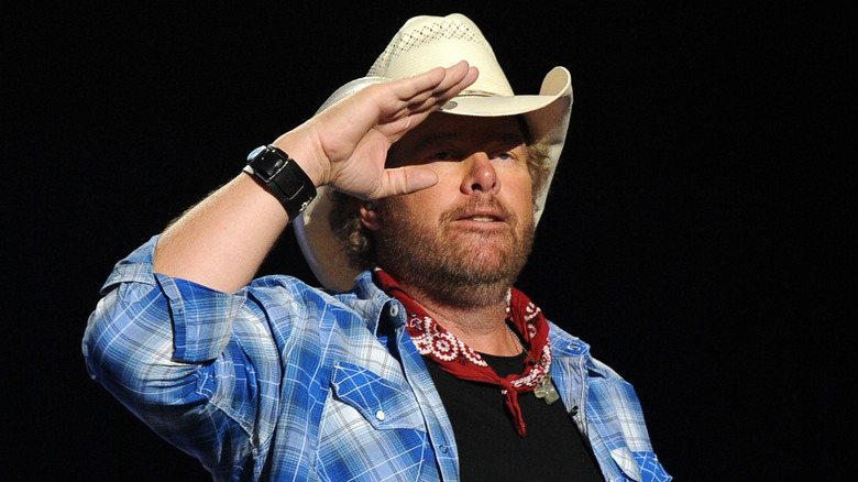 Toby Keith saluting in cowboy hat