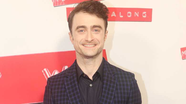 Daniel Radcliffe smiles on red carpet