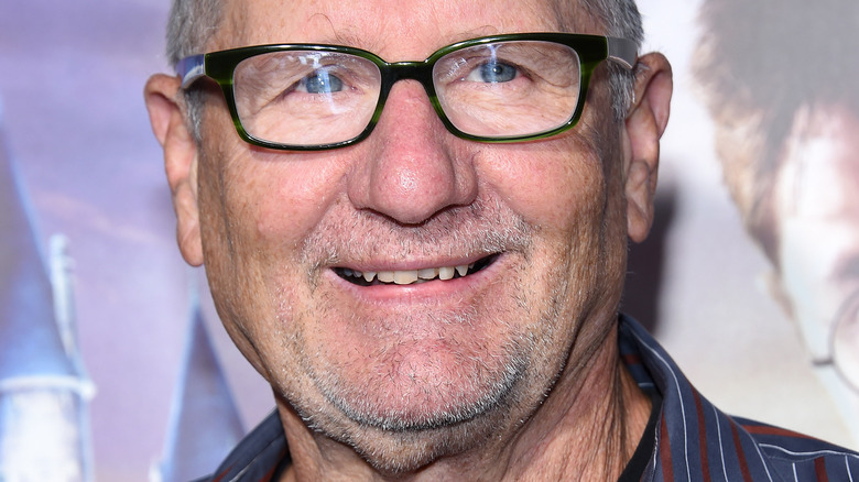 Ed O'Neill smiling in glasses