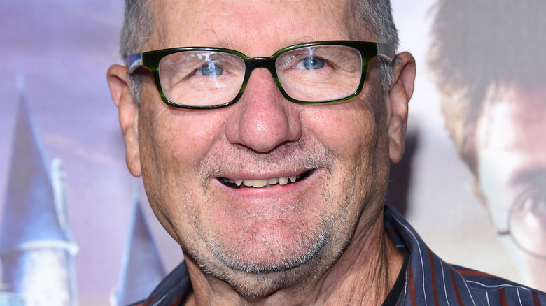 Ed O'Neill smiling in glasses