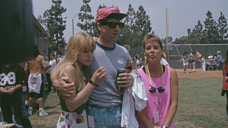 Ed O'Neill and Amanda Bearse at baseball game