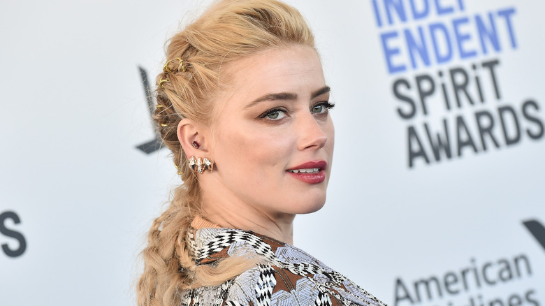 Amber Heard diamond earrings plaited hair