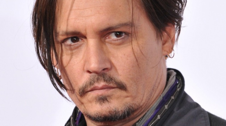 Johnny Depp looking to side