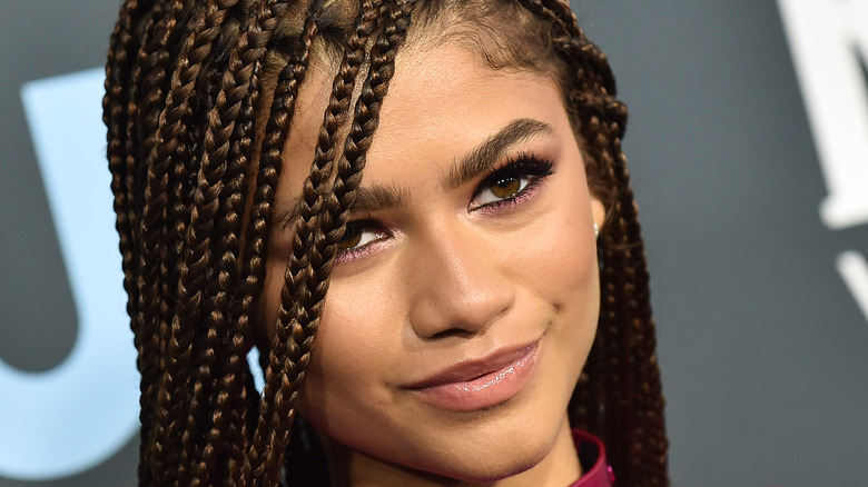 Zendaya smiling toward camera