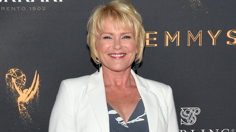 Judi Evans smiles for a photo