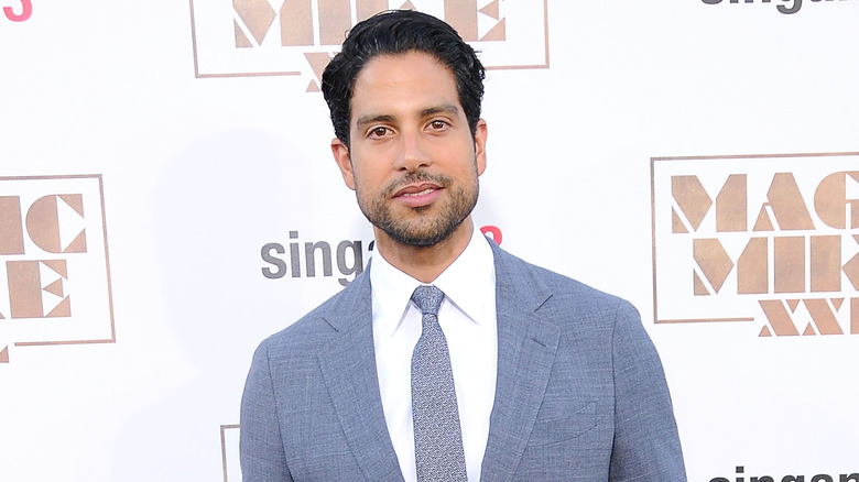 Adam Rodriguez in blue suit