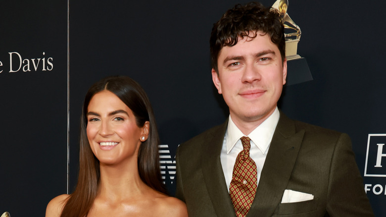 Kaitlan Collins and Emilio Madrid smiling together at the 2026 Grammys.