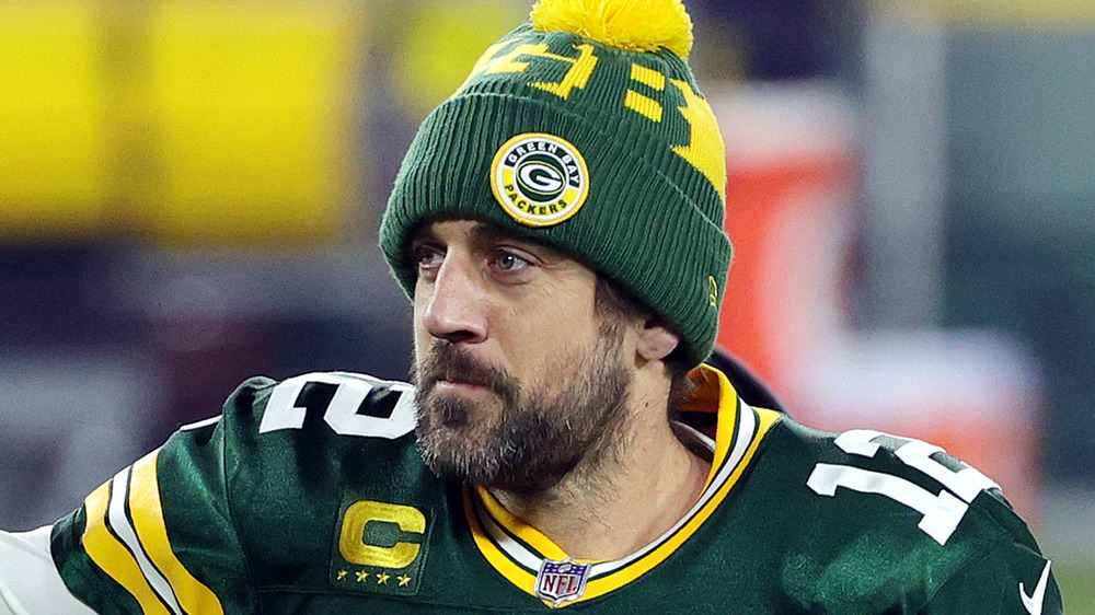 Aaron Rodgers smiling on the field