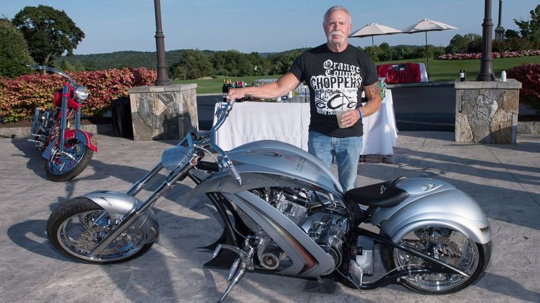 Paul Teutul Sr. posing with bike
