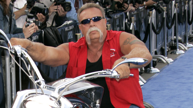 Paul Teutul Sr. posing on bike