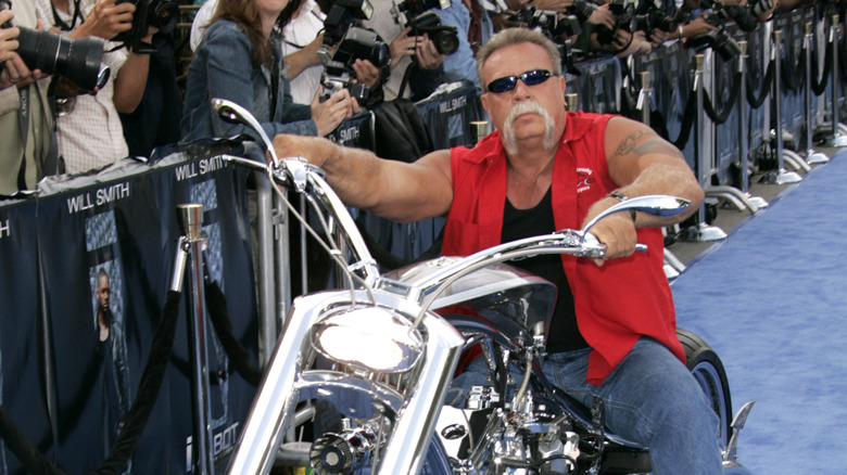 Paul Teutul Sr. posing on bike