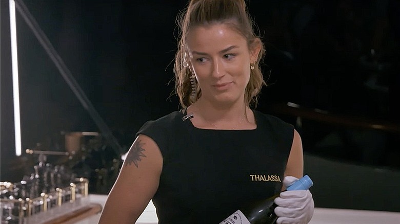 Aesha Scott holding wine