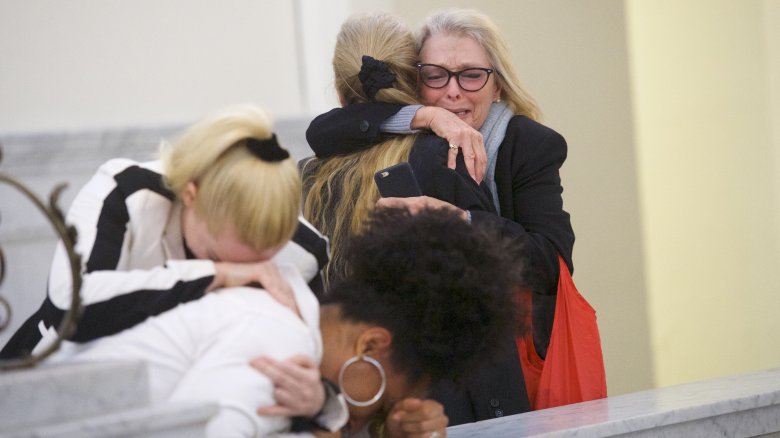 Women react following the Bill Cosby guilty verdict