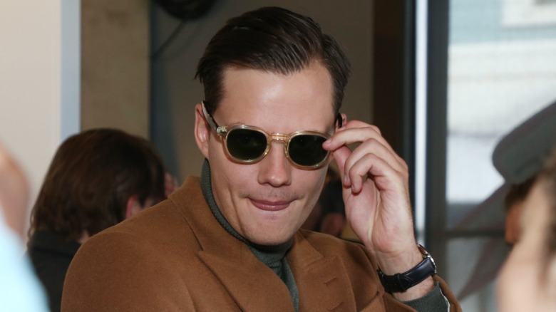 Bill Skarsgård wearing sunglasses