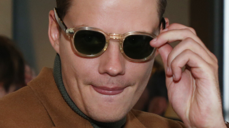 Bill Skarsgård wearing sunglasses