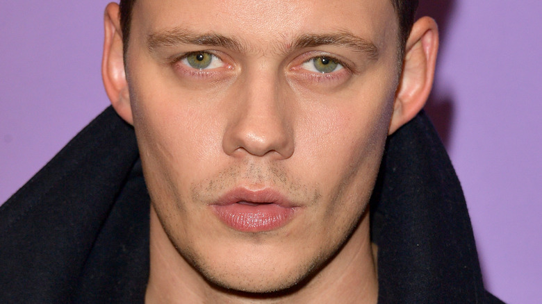 Bill Skarsgård posing at event