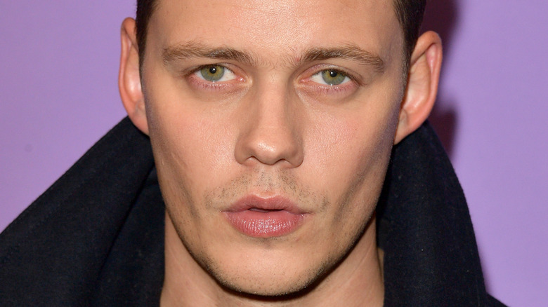 Bill Skarsgård posing at event