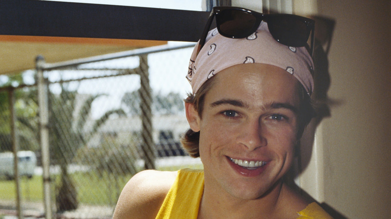 Brad Pitt in a tank top, smiling