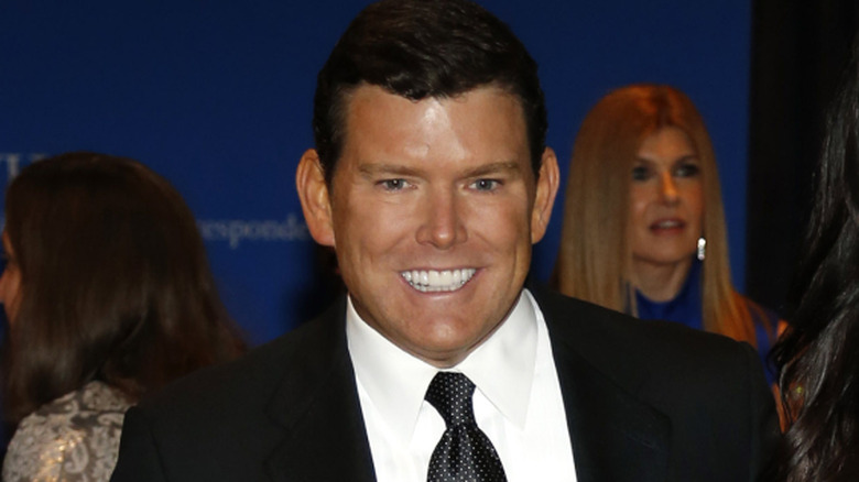 Bret Baier posing for cameras, flashing teeth