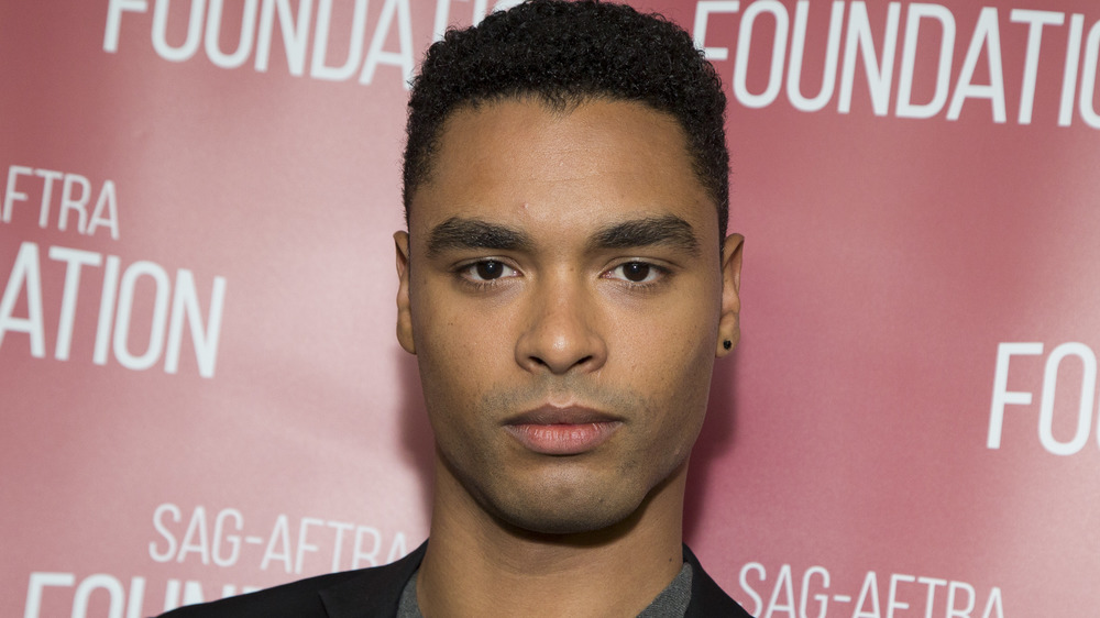 Regé-Jean Page smirking