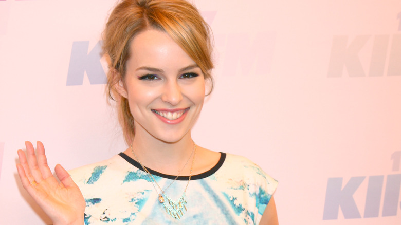 Bridgit Mendler smiling and waving