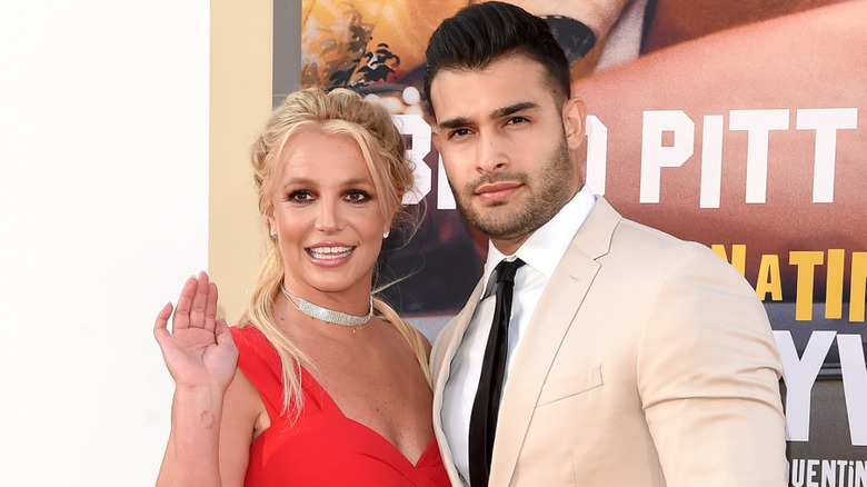 Sam Asghari and Britney Spears pose together