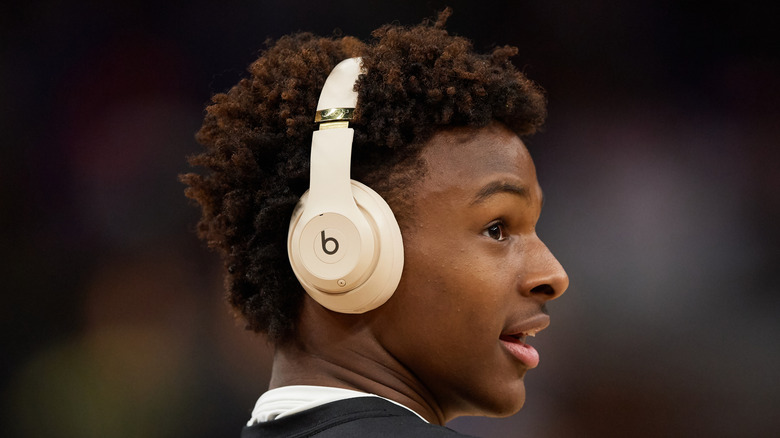 Bronny James wearing headphones