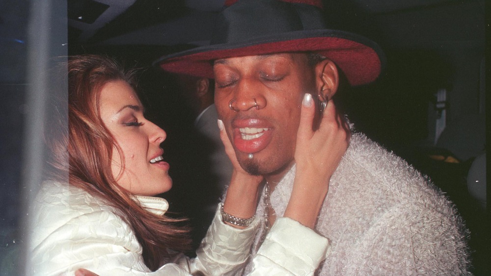 Carmen Electra and Dennis Rodman eyes closed
