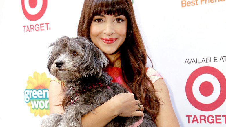 Hannah Simone holding a dog