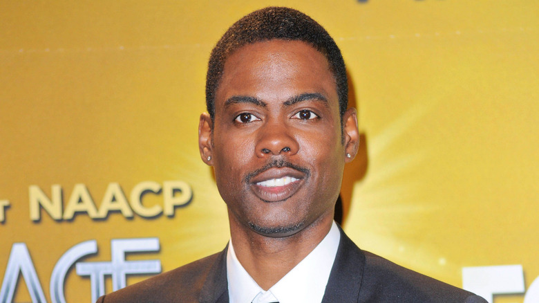 Chris Rock holding an award