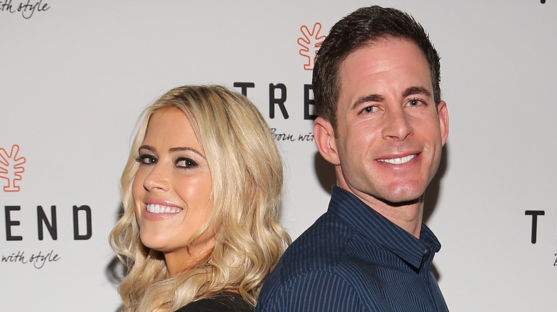 Christina Haack and Tarek El Moussa posing back-to-back